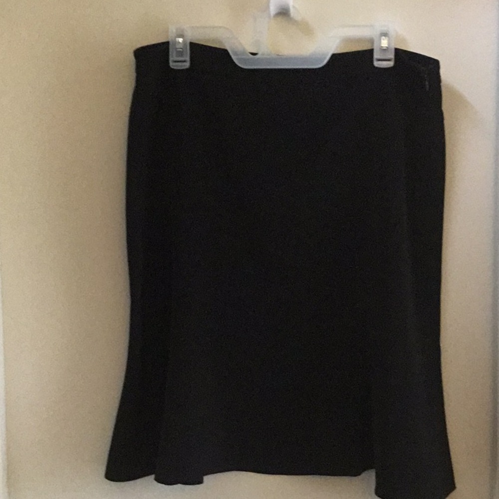 Black skirt with a slight design. Hard to see in photos size 14